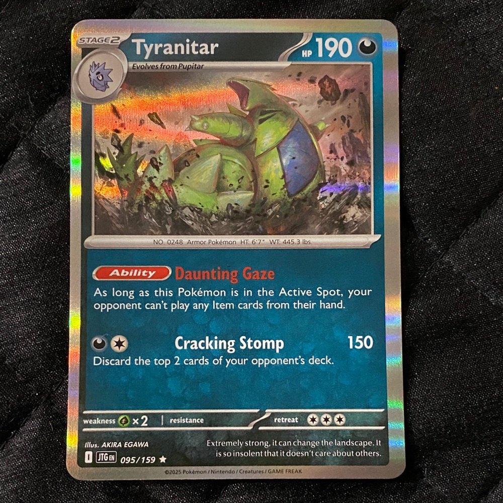 Tyranitar Holo Trading Card with Green and Blue Accents